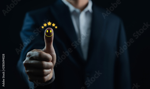 Konstfotografi Business professional giving a thumbs up with glowing five stars, symbolizing excellent ratings, customer satisfaction, approval, quality, positive feedback, trust, service, and success