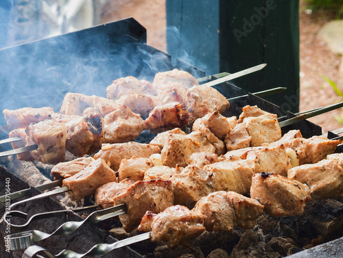 Canvastavla Traditional pork shashlik is skewered over coals