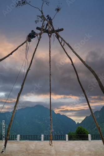 Giant Swing Construction and rope-tying details for the Akha swing-rocking ceremony during the New Year festival at Ban Pha Hi, Mae Sai, Chiang Rai, Thailand.