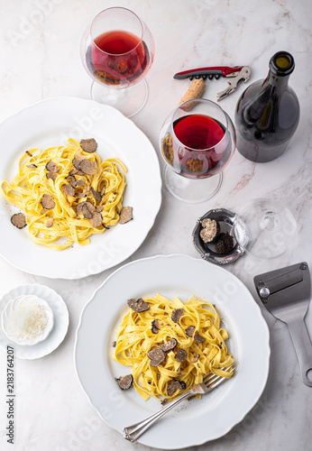 Tagliatelle pasta with black truffle mushrooms. Tagliatelle al tartufo - Italian autumn fresh recipe with black truffle.  Which wine goes best with truffle pasta