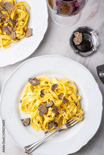 Tagliatelle pasta with black truffle mushrooms. Tagliatelle al tartufo - Italian autumn fresh recipe with black truffle.  Which wine goes best with truffle pasta