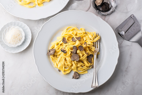 Tagliatelle pasta with black truffle mushrooms. Tagliatelle al tartufo - Italian autumn fresh recipe with black truffle.  Which wine goes best with truffle pasta