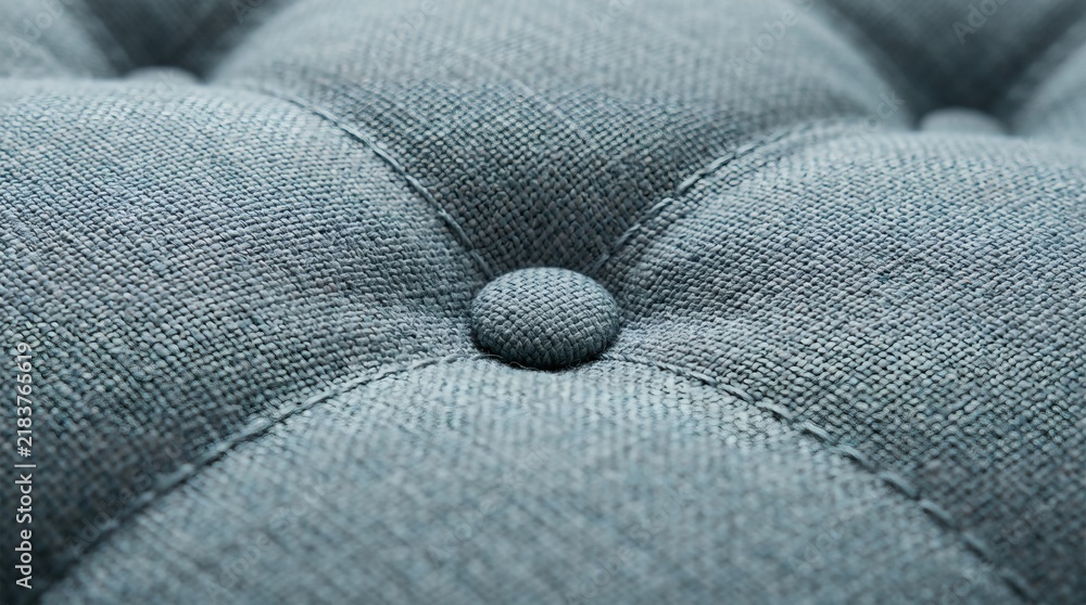 Obraz premium Close-up of Teal Upholstery Fabric with Button Tufting Detail.