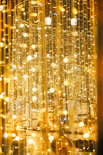 Golden glowing illumination creates a magical winter bokeh