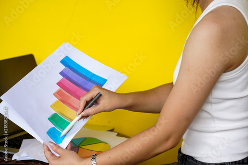 hands of a woman painting a picture