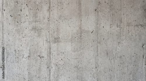 Raw concrete wall texture with vertical board marks and porous details for architecture.