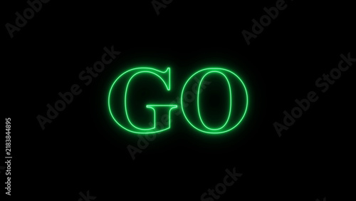 Green neon glowing text go in a serif font on a dark black background, for motion and, digital signage display