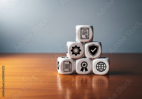 Conceptual stack of white dice with business and compliance icons