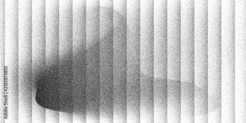 A dark brushed metal texture background features a sleek silver metallic surface with striped grey lines. Reeded glass with black and white gradient. Abstract grayscale background with soft gradient w