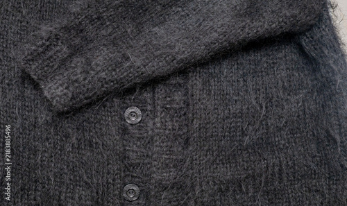 Foto Fluffy black long-haired chunky knit mohair cardigan for background and texture