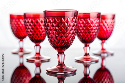 Colorful Red Glassware Presented in a Minimal White Setting
