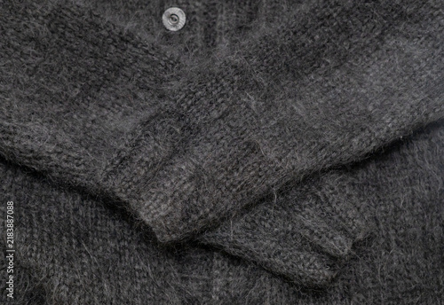 Konstfotografi Fluffy black long-haired chunky knit mohair cardigan for background and texture