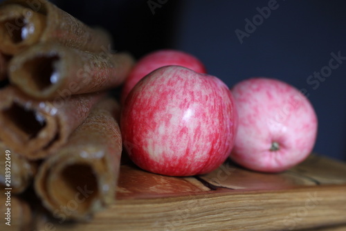 apple pastila rolled up on a blurred background with an apple.