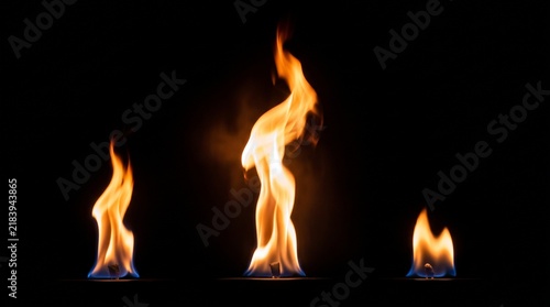 Dynamic Trio of Vivid Orange Flames Illuminating Darkness with Fiery Energy