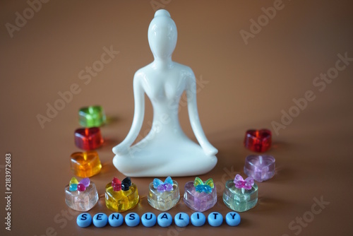 The inscription is sensuality, hearts and a ceramic figurine of a woman.