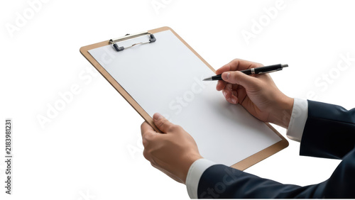 A businessman in a suit holding a clipboard and writing with a pen on paper