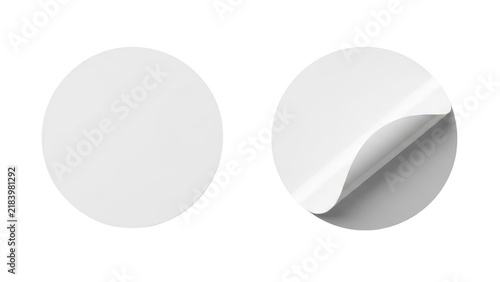 Two round blank paper stickers with one edge peeling up for branding and design