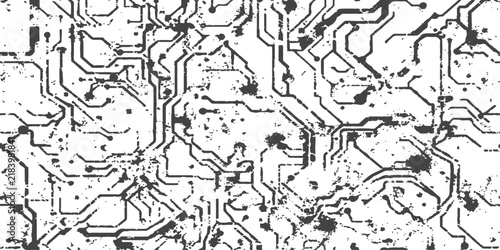 Grungy abstract circuit board pattern with digital lines and speckles in monochrome for technology backgrounds