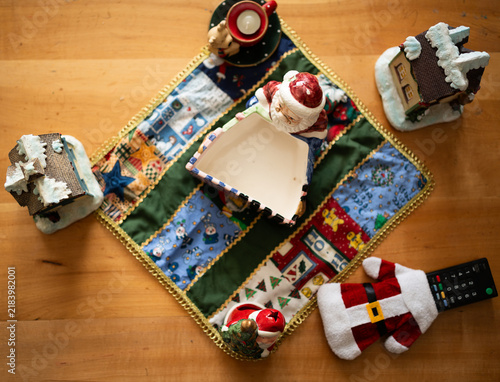 Top View Christmas Table Decoration with Santa Ornaments and Snow Cottages