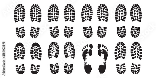 фотографія Set of black shoe sole prints and human footprints isolated on a simple backgrou