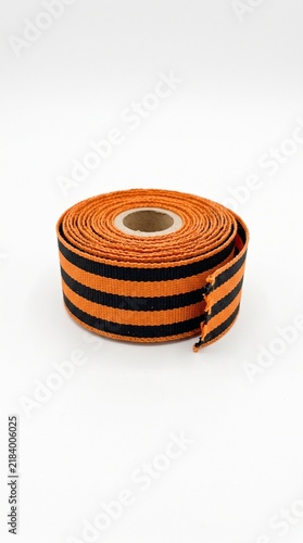 Orange and black striped ribbon roll for festive decorations and crafts