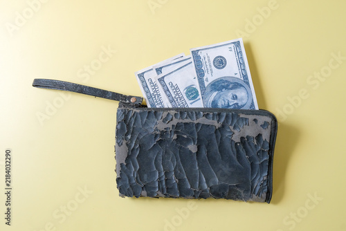 A piece of money in Damaged wallet.