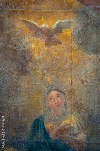 Photography A painted depiction shows Virgin Mary looking upward toward the Holy Spirit as a dove
