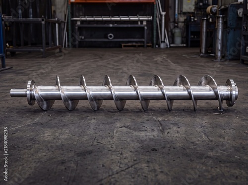 Screw Conveyor Shaft with Flighting Resting on Factory Floor