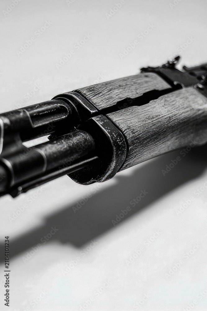 Obraz premium Close-up shot of an Ak-47 rifle in black and white. vertical frame