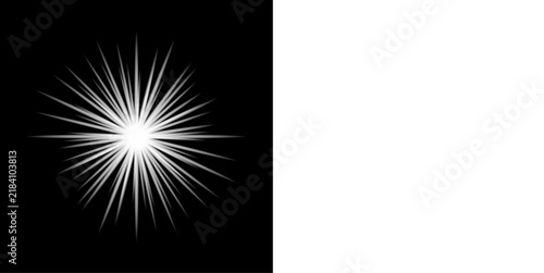 A bright white starburst effect centered on a solid black background next to white space with starburst pattern sharp