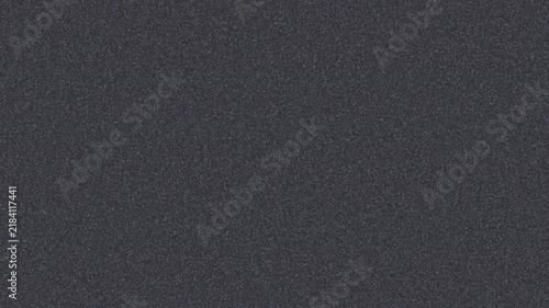 Old TV screen white noise texture background loop with grainy static dots. Retro television broadcasting failure overlay element without analog signal input. Classic gray electronic tv