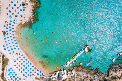 Konnos beach full of people swimming in a turquoise water. Cyprus