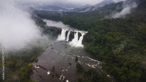 Photography Powerful cascades of Athirappilly Waterfalls surrounded by Kerala forest