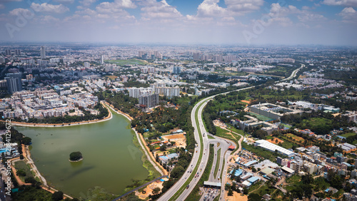 Photography Aerial view of urban lake and road network in Bangalore