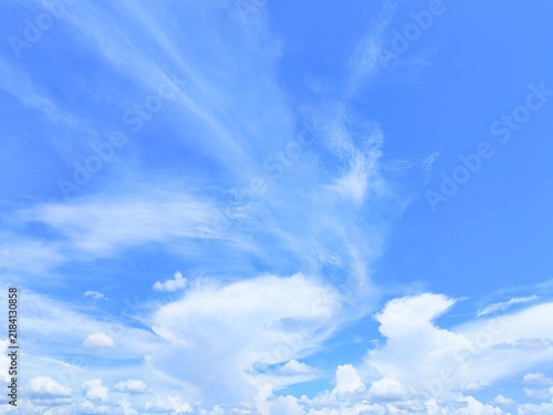 Obraz na plátne Blue sky with white clouds bright sunny day background beautiful nature cloudscape heaven fluffy atmosphere summer weather concept natural environment wallpaper