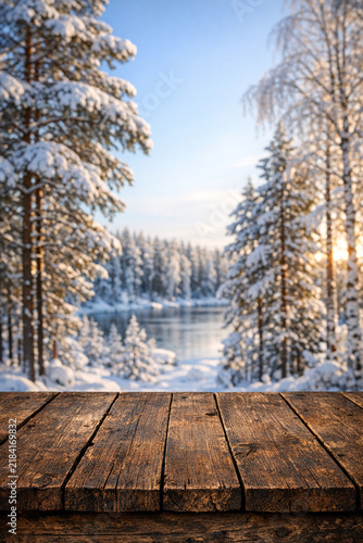 A serene winter scene with a tranquil lake, surrounded by trees and illuminated by the warm glow of the sunset.