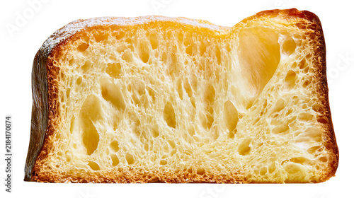 Картината върху платно Isolated slice of rich Italian holiday sweet bread, panettone or pandoro, with airy texture