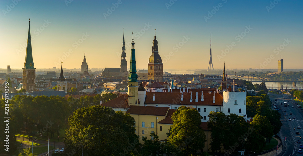 Obraz premium Aerial panoramic view of Old Riga during sunrise in summer, Riga Castle in foreground
