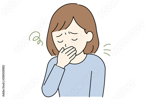 woman covering her mouth in discomfort due to nausea, morning sickness, or feeling sick.