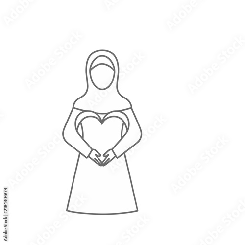 Woman in hijab holding heart shape