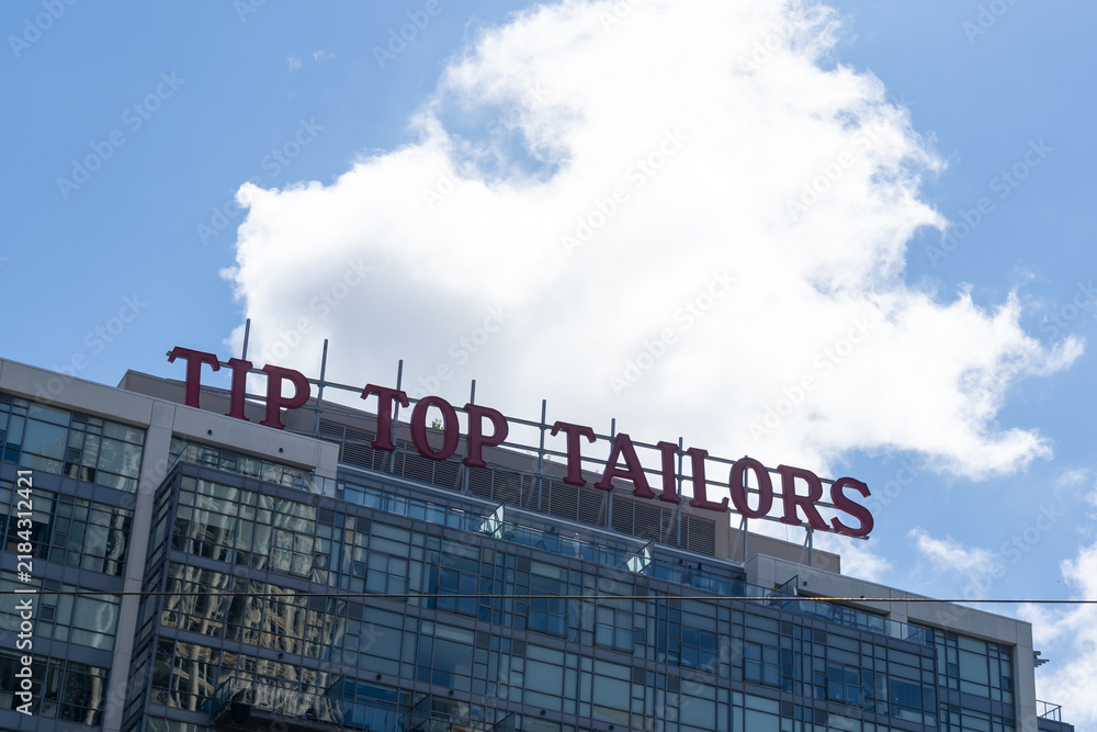 Obraz premium Toronto, Ontario, Canada - September 7, 2026: Top of the Tip Top Tailors Building in 2026. 