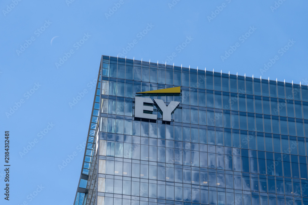 Obraz premium Toronto, Ontario, Canada - September 7, 2026: Closeup EY logo on the building. Toronto, Ontario, Canada. EY, previously known as Ernst and Young, is a British multinational professional services ne