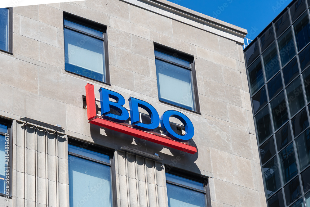 Obraz premium Toronto, Ontario, Canada - September 7, 2026: An exterior logo sign for BDO Canada on the building in Toronto, Ontario, Canada. BDO is a major international network of public accounting, tax, and advi