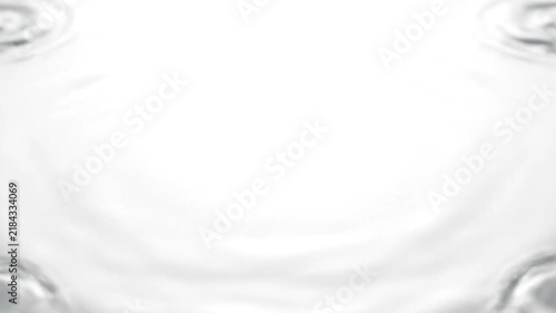 A single clear water drop creates a ripple on white surface