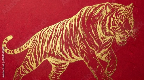 Golden tiger silhouette walking on a vibrant red background representing strength power and chinese new year