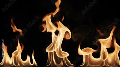 Fire Flame Fireplace Background with Golden Glowing Abstract Shapes, Warm Dancing Light and Dramatic Radiant Heat Creating Cozy Dark Atmospheric Scene with Flowing Patterns