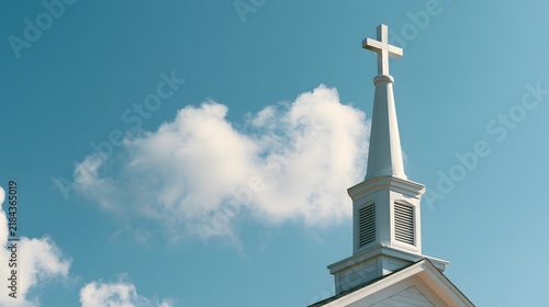 Tapety artystyczne White Church Steeple with Cross Against Blue Sky and Clouds