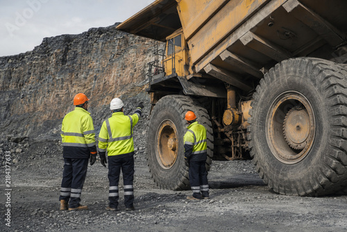 Mining Crew Performing Haul Truck Safety Inspection