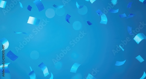 Vibrant blue confetti pieces drifting slowly against a matching azure backdrop with soft bokeh circles and ample empty space for your text, holiday, motion, minimal