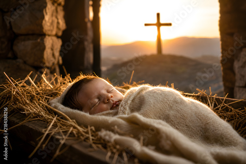 Newborn baby sleeps in a hay manger at sunrise with a cross silhouette, capturing the sacred birth of Jesus